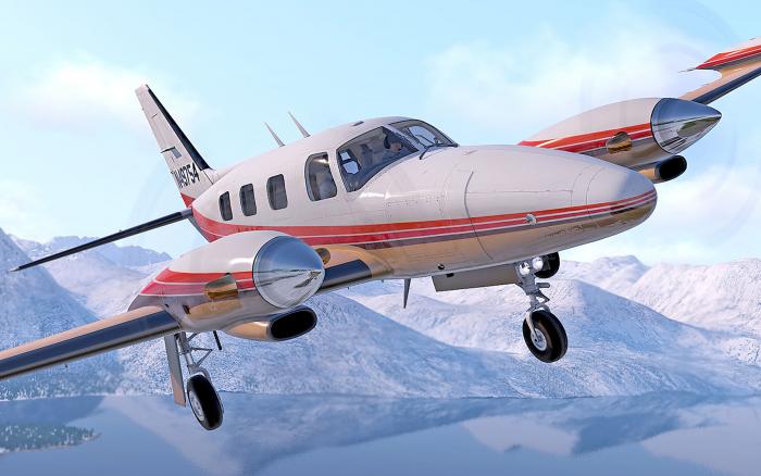 Beechcraft Royal Turbine Duke in flight over snow-capped mountains